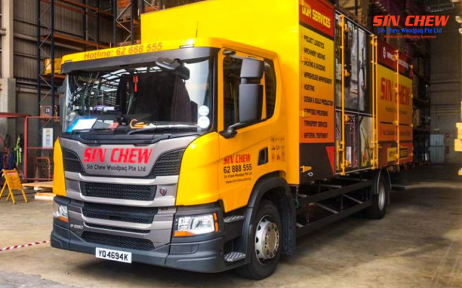 Sin Chew truck parked in a logistics warehouse.